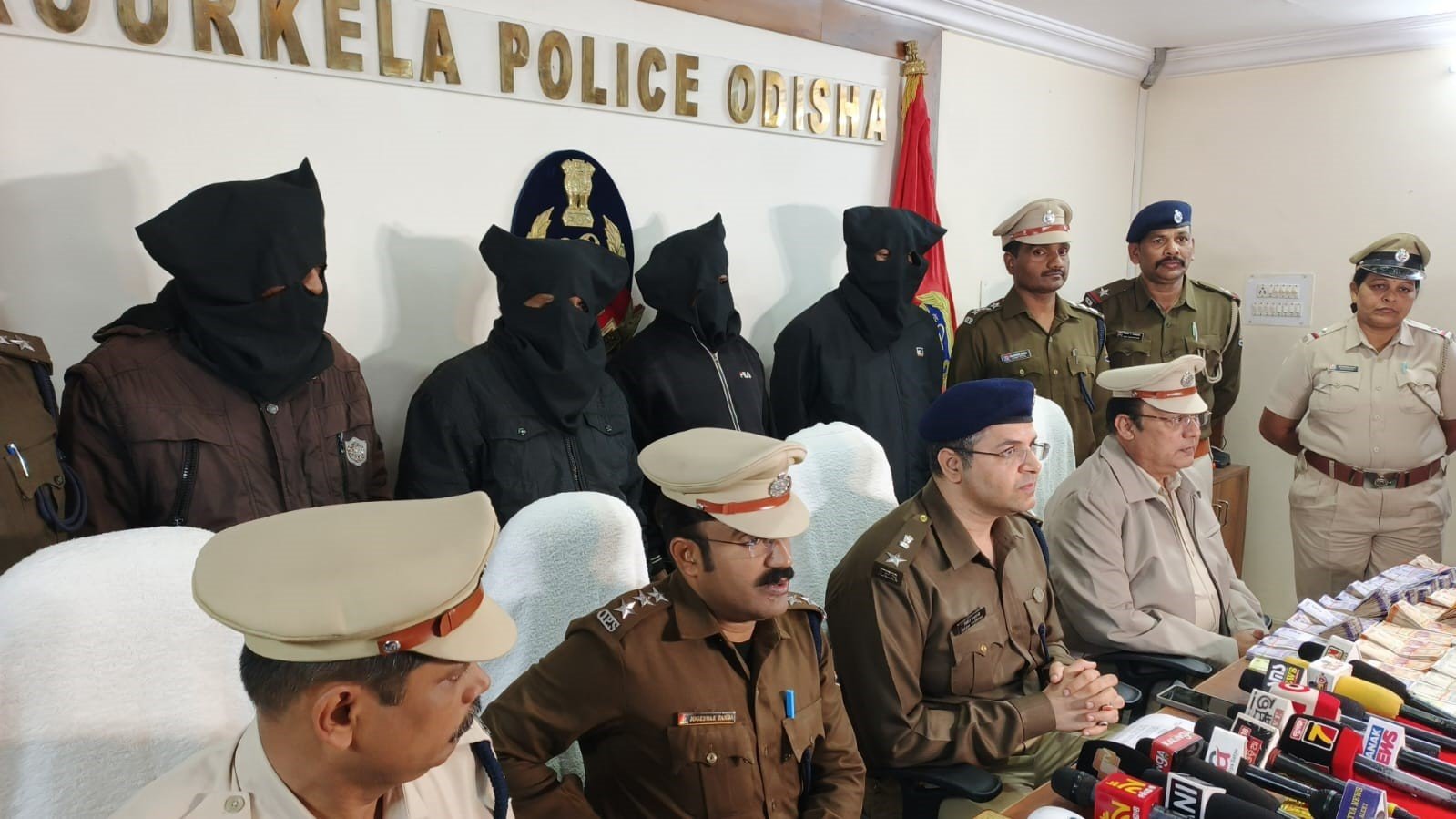 Police display seized cash and materials after illegal lottery racket busted in Rourkela